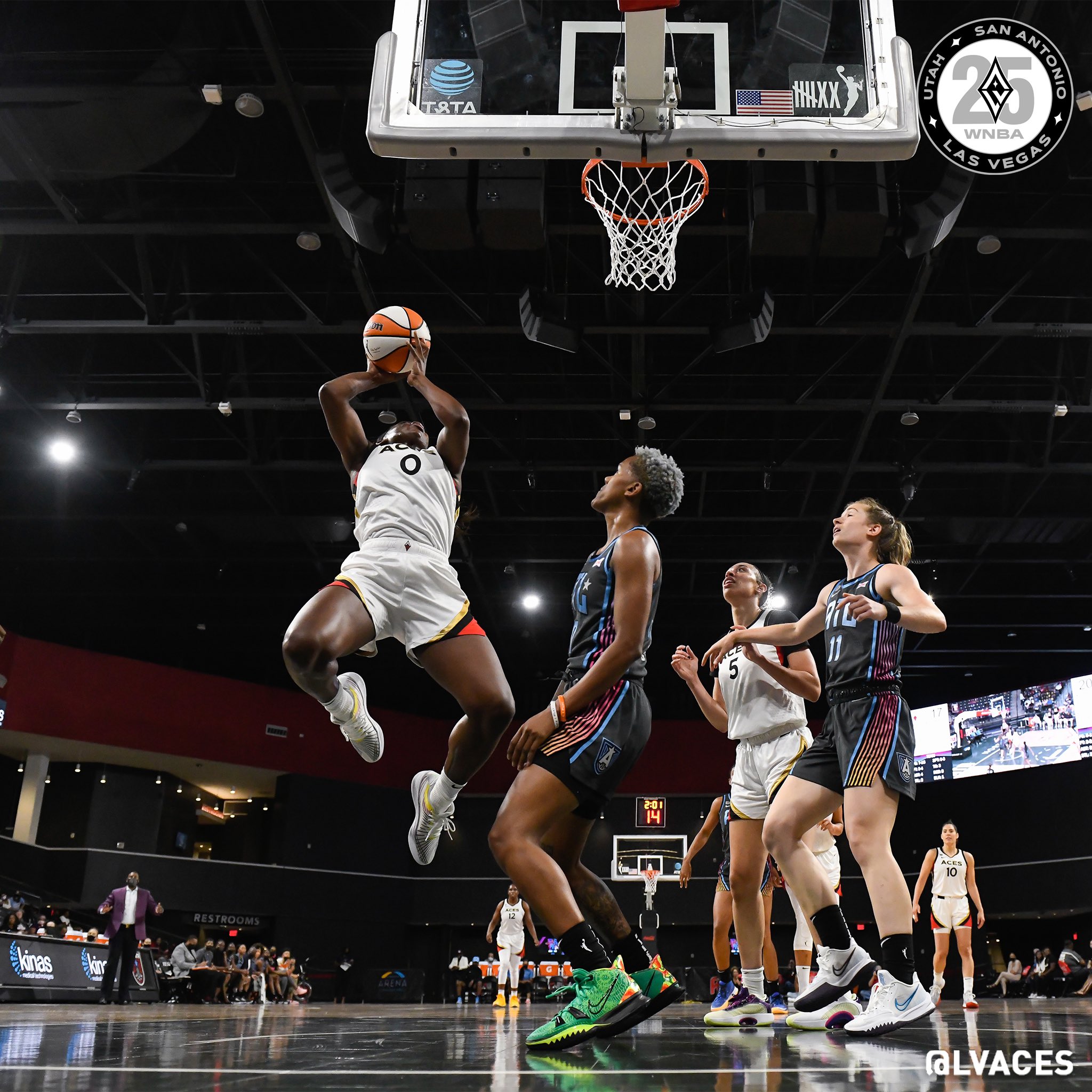 Jackie Young jumping toward the basket with the ball