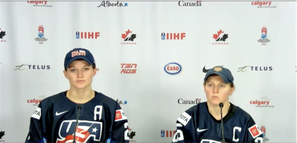 USA CAPTAINS LEE STECKLEIN (LEFT) AND KENDALL COYNE SCHOFIELD TALK TO MEDIA AFTER A 5-1 LOSS TO CANADA. AUGUST 26, 2021, CALGARY, ALBERTA