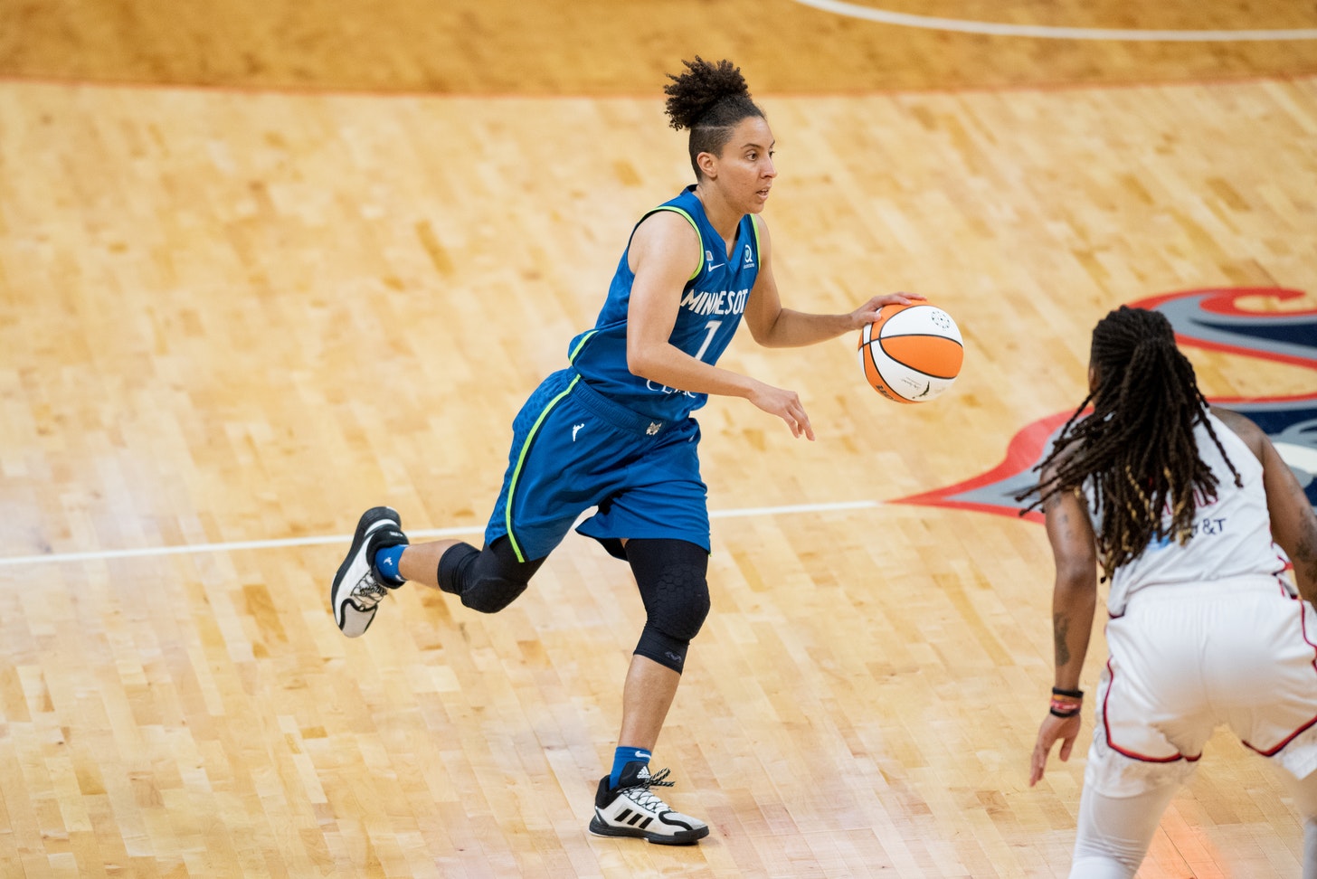 Minnesota Lynx guard Layshia Clarendon looks to pass the ball in a game against the Washington Mystics on June 8, 2021. (Photo credit: Domenic Allegra)
