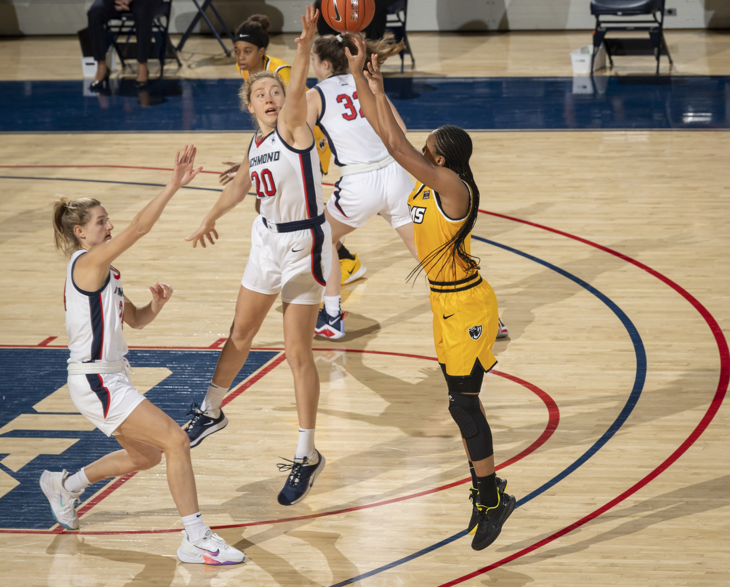 Addie Budnik goes up for the block against VCU