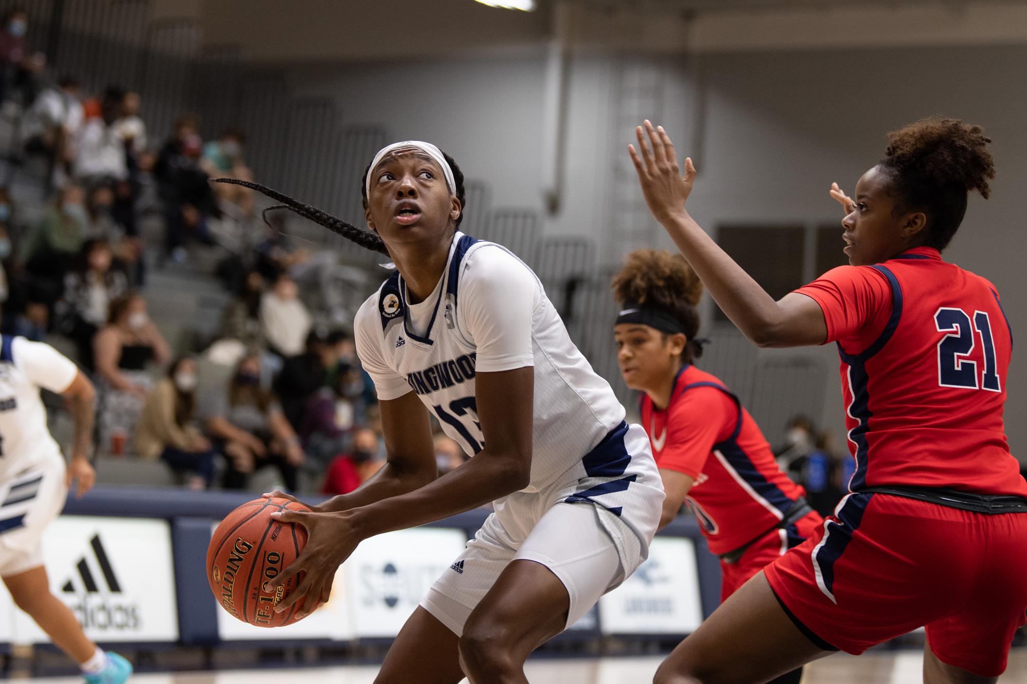 Akila Smith prepares to go vertical for a layup with the post defender sagging off of her,