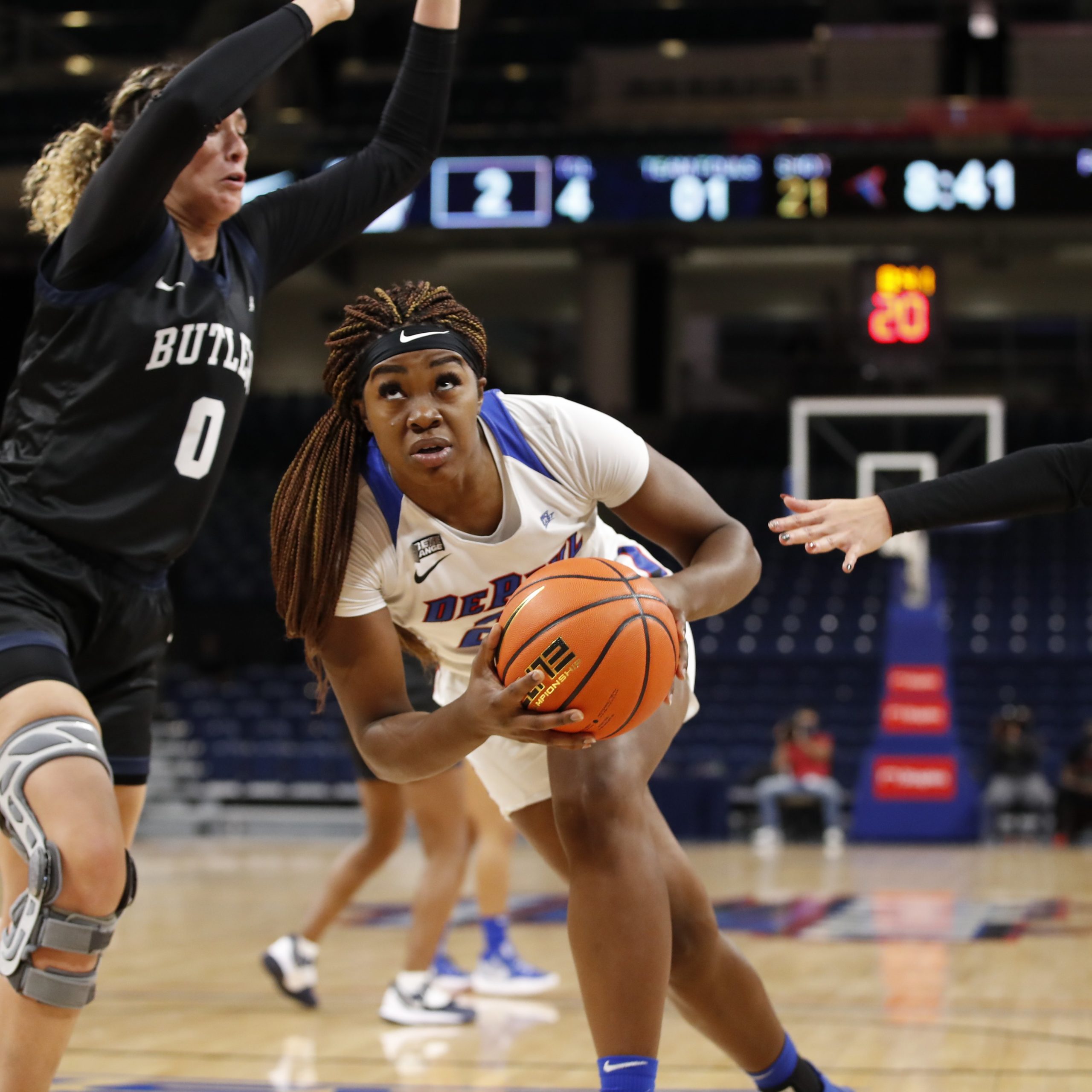 Aneesah Morrow puts her head down as she drives past an outstretched defender beside her