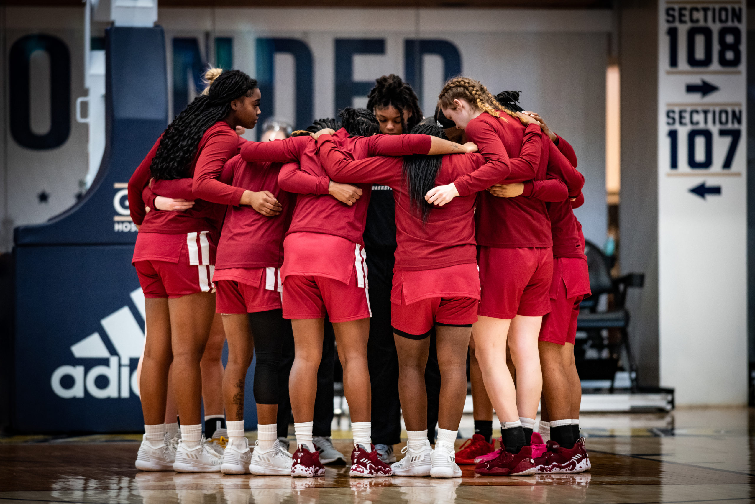 UMass women's basketball team huddles before its game against George Washington.