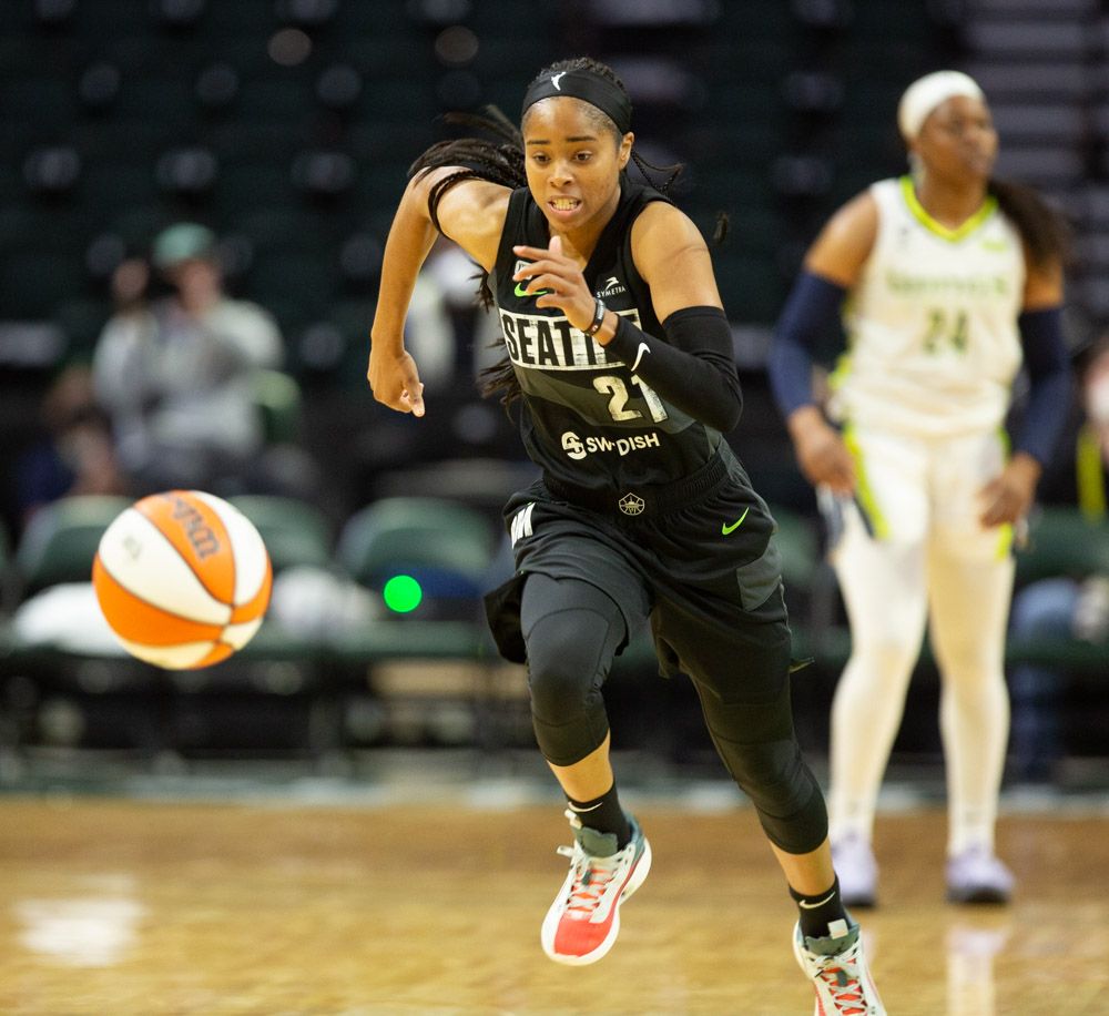 Jordin Canada chases after a loose ball