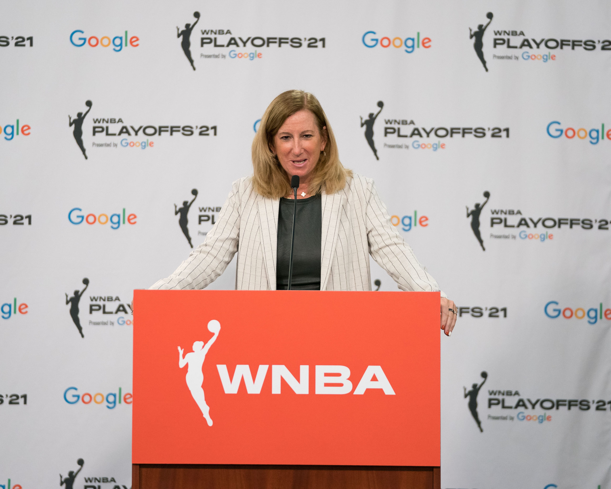 Commissioner Cathy Engelbert at the podium at the 2021 WNBA playoffs
