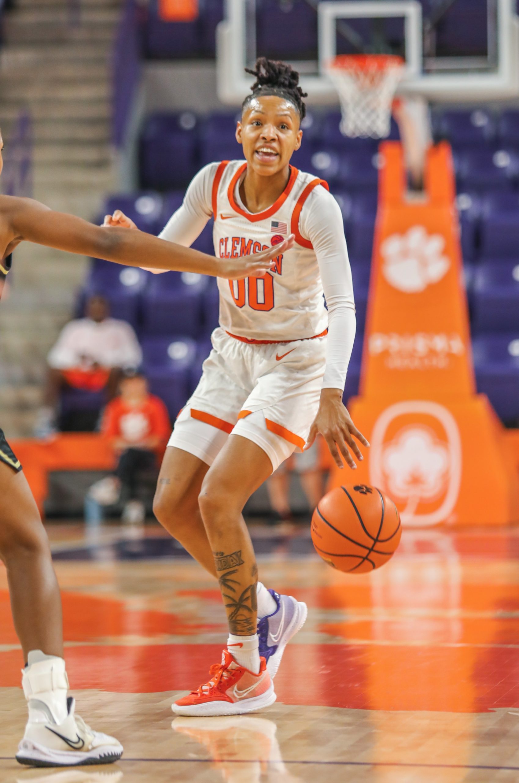 Delicia Washington calls out a play while dribbling the ball