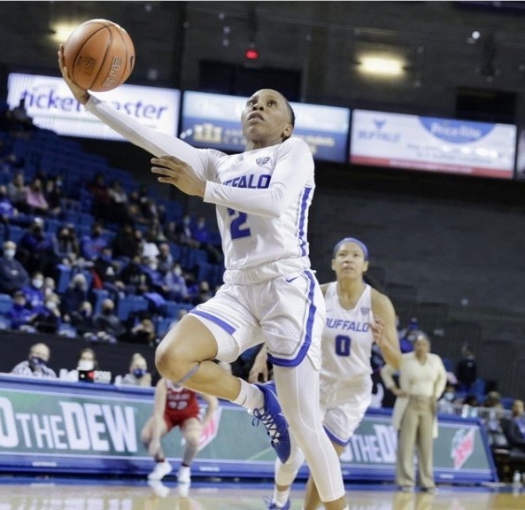 Dyaisha Fair rises with her shooting arm extended to take a layup