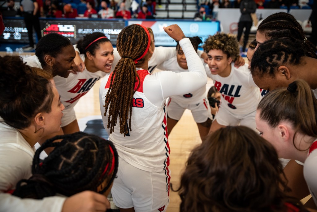 Araion Bradshaw hypes up the rest of the Dayton team in a huddle.