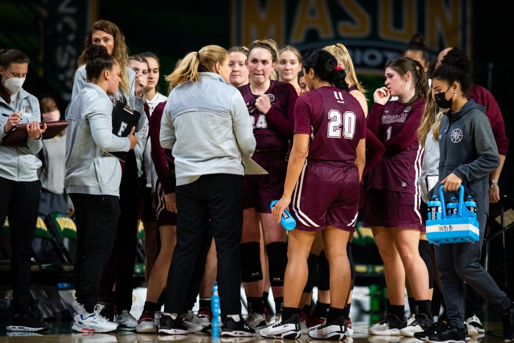 Fordham huddles up during a timeout.