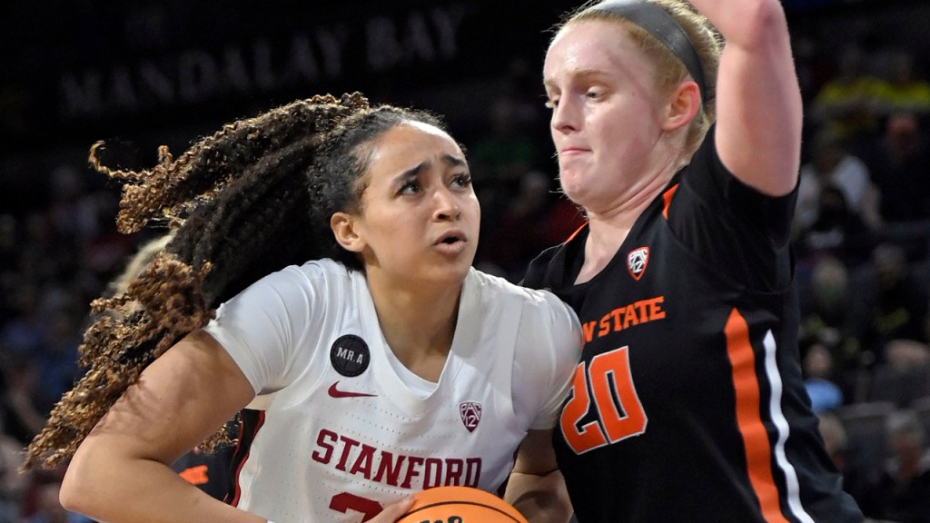 Haley Jones puts her shoulder into Oregon State's Ellie Mack as she drives towards the hoop
