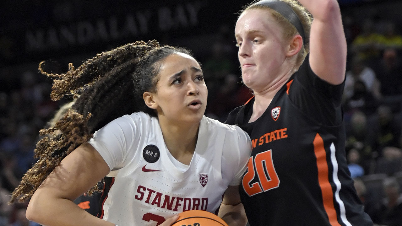 Haley Jones puts her shoulder into Oregon State's Ellie Mack as she drives towards the hoop
