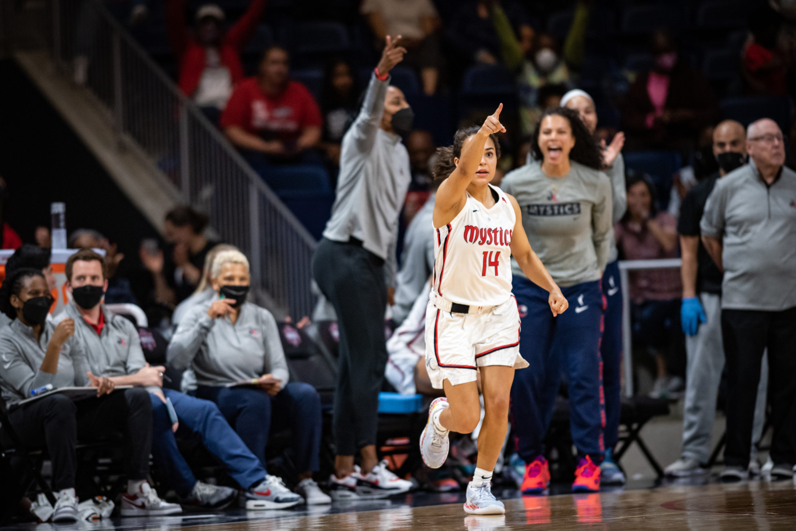 Katie Benzan points to a teammate