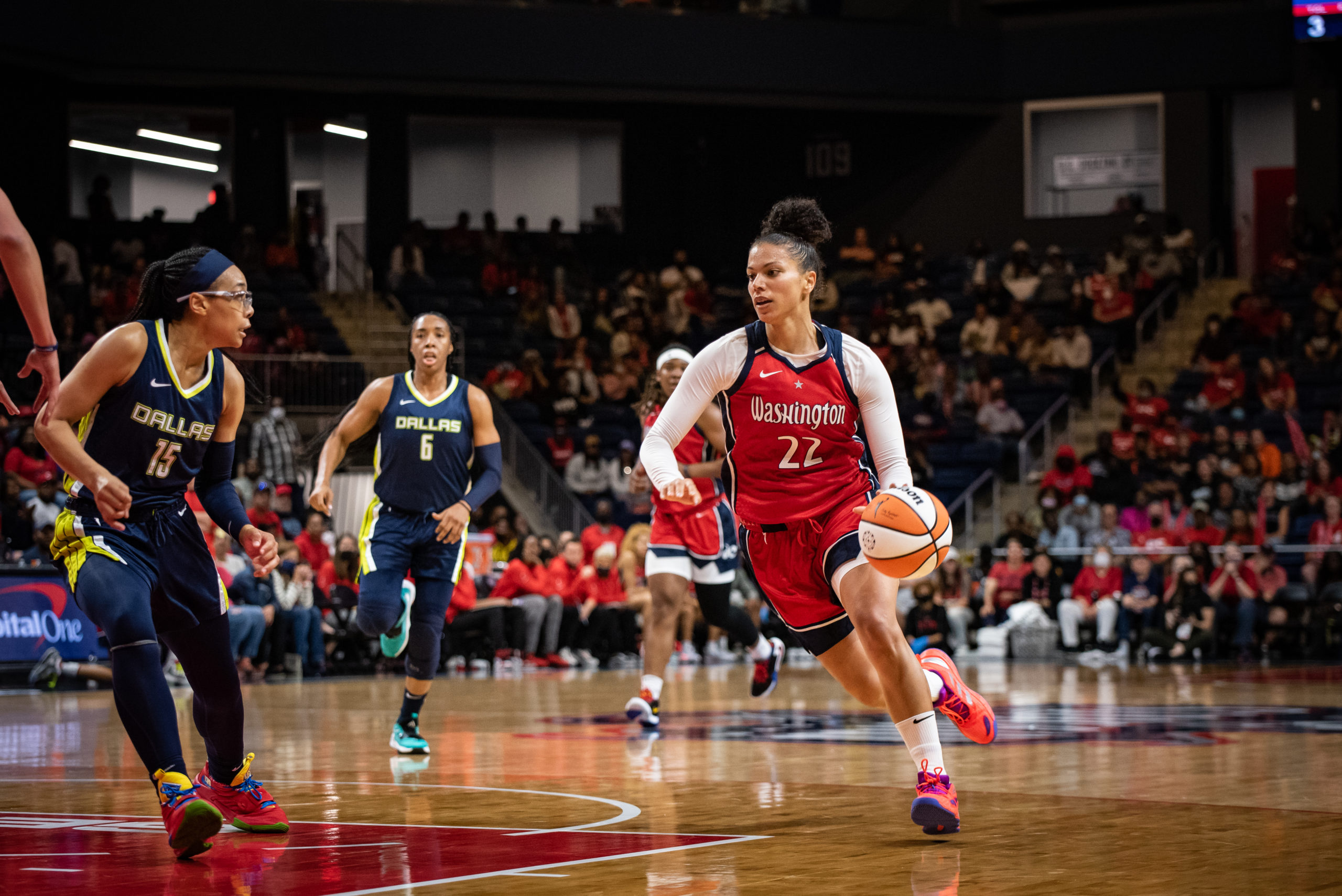 Washington Mystics forward Alysha Clark (22) drives against Dallas Wings guard Allisha Gray (15) in a game at the Entertainment and Sports Arena in Washington, DC, on May 13, 2022. (Photo credit: Domenic Allegra)