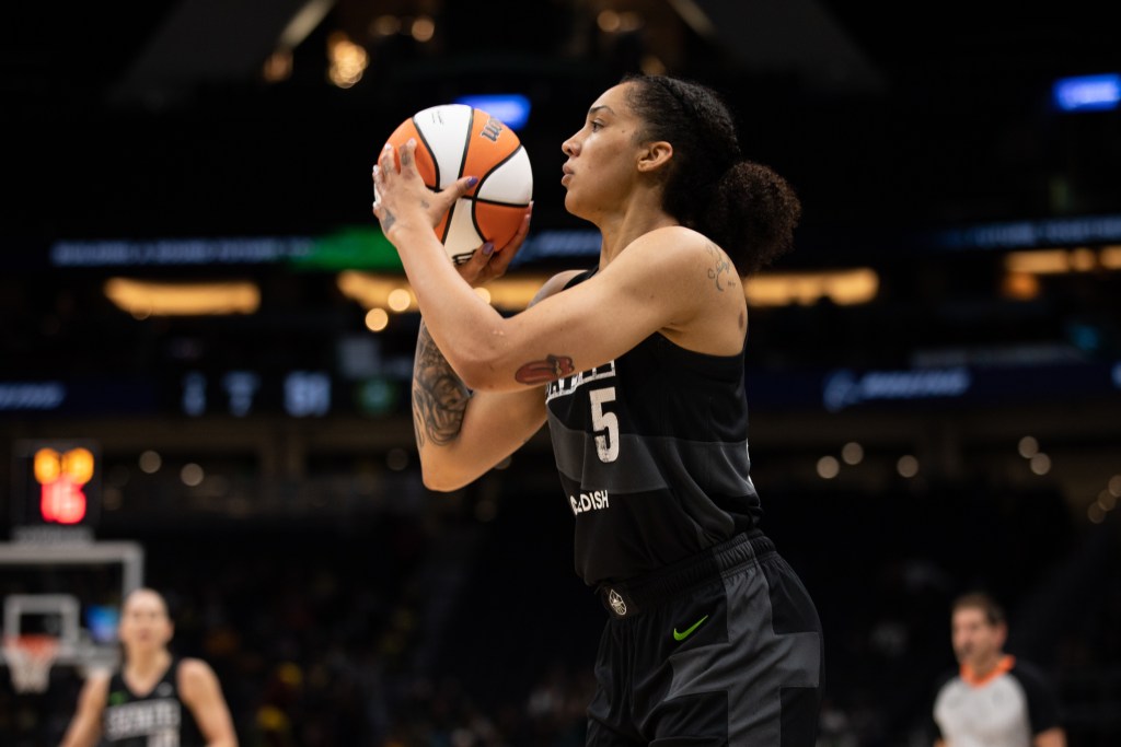 Seattle Storm off-ball guard Gabby Williams gets into her jumper form before taking a shot