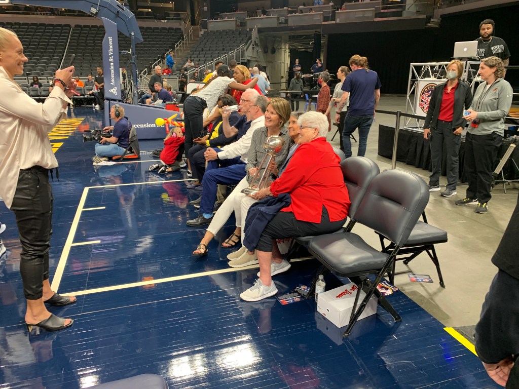 Kelly Krauskopf, Lin Dunn, and Mickie DeMoss with the Indiana Fever's 2012 championship trophy