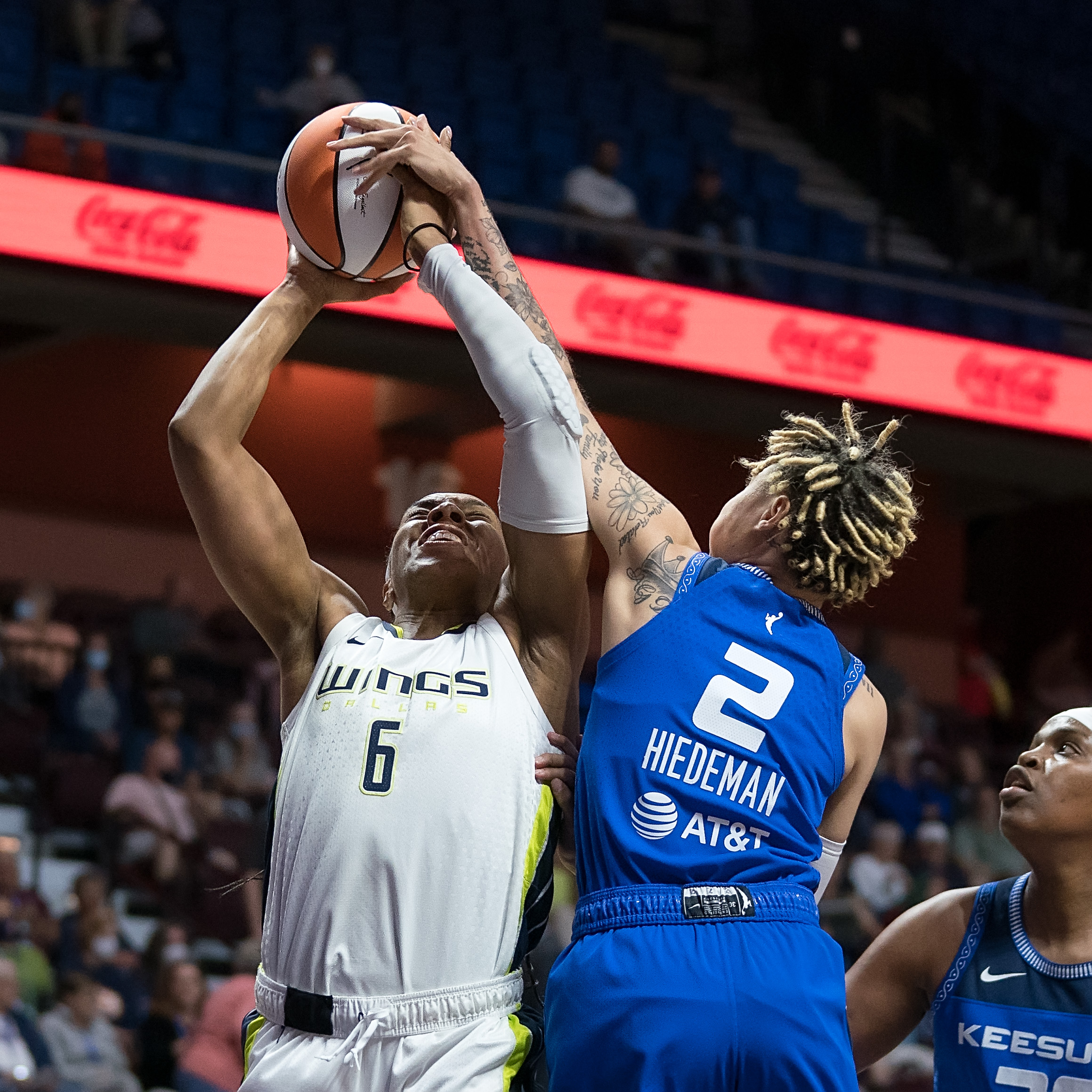 Connecticut Sun combo guard Natisha Hiedeman blocks a layup straight-on from Dallas Wings combo forward Kayla Thornton