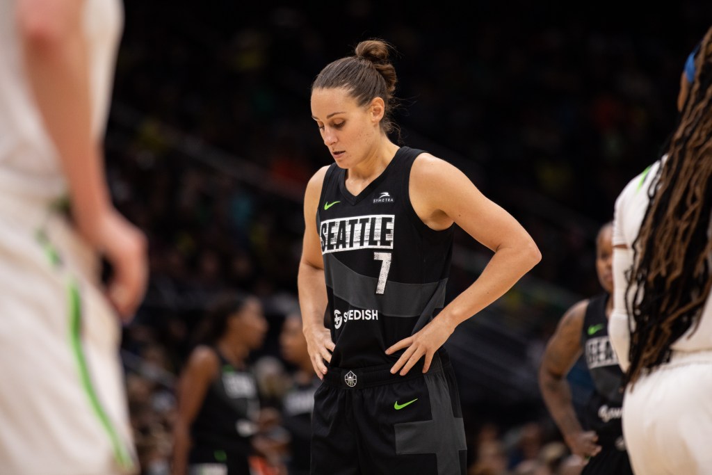 Seattle Storm combo forward Stephanie Talbot holds her hands on her hips while looking down