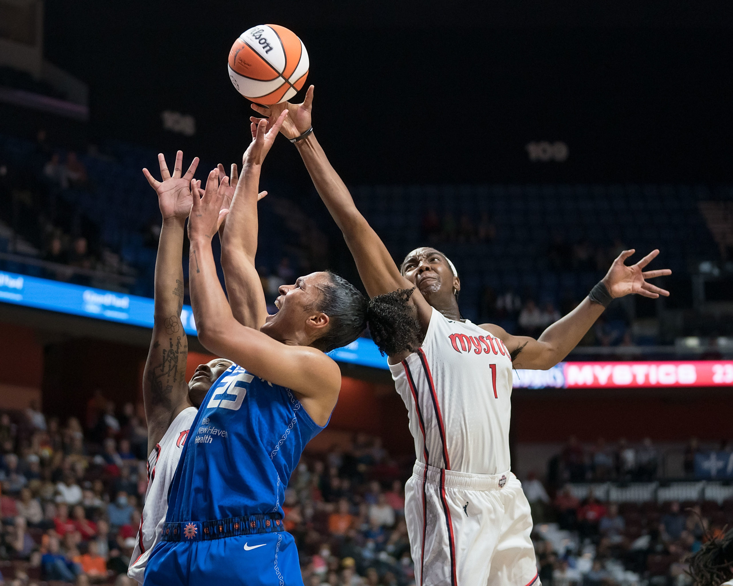 Washington Mystics center/forward Elizabeth Williams (1) blocks the shot of Connecticut Sun forward Alyssa Thomas (25) during a game at Mohegan Sun Arena in Uncasville, Connecticut, on May 28, 2022.