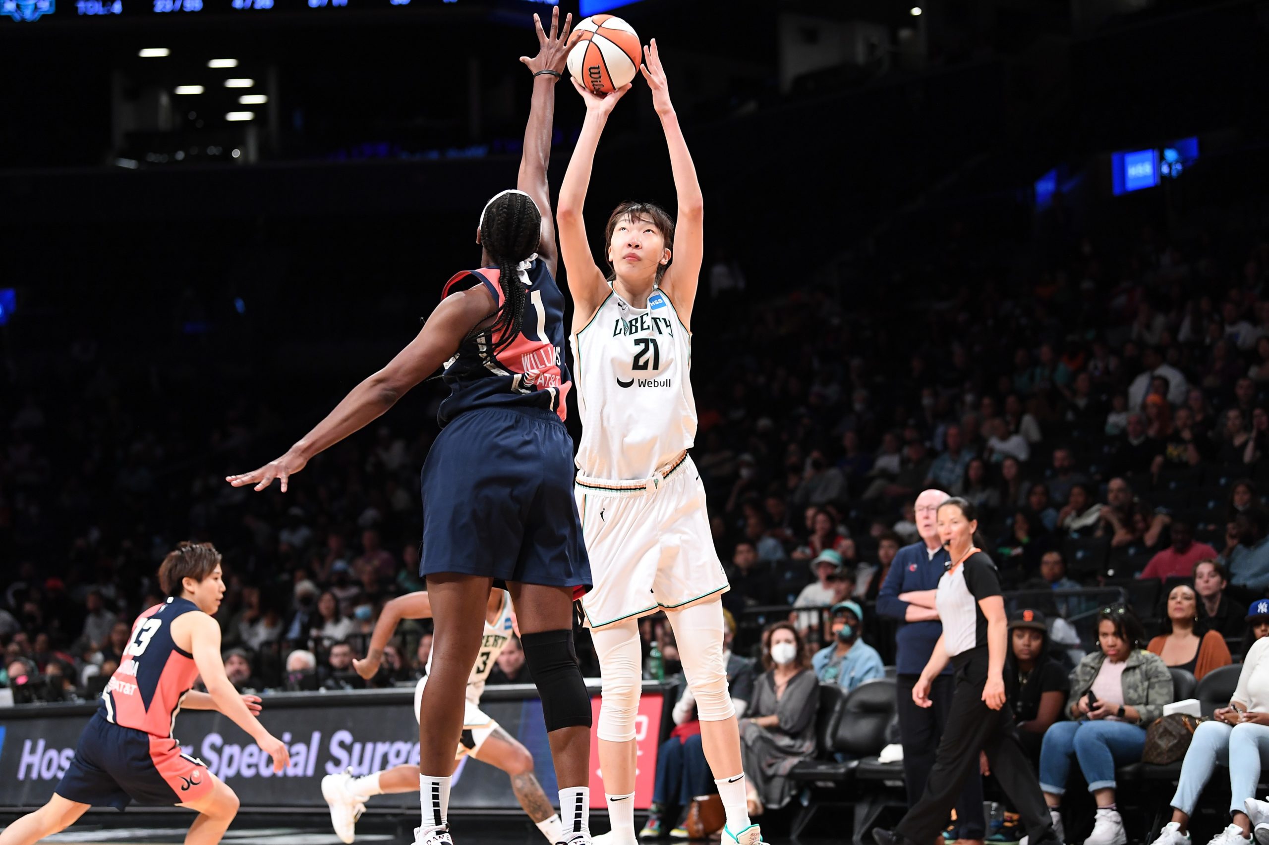 Han Xu shoots over Elizabeth Williams in the Liberty's 77-65 victory over the Mystics