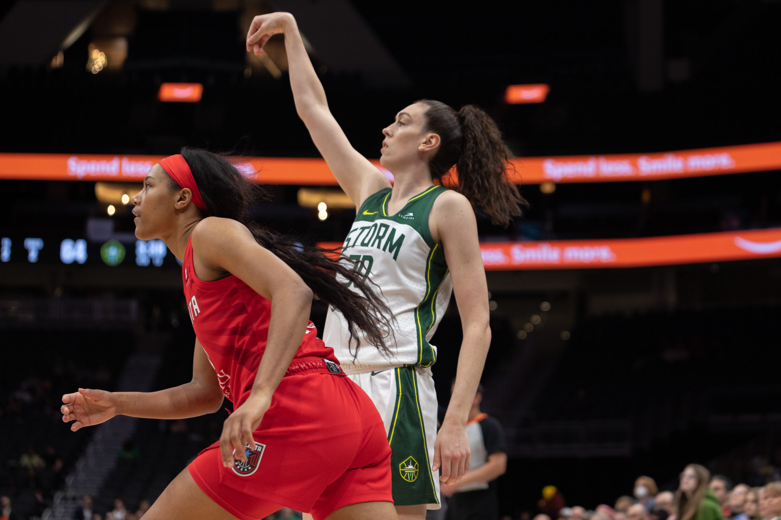 Seattle Storm forward Breanna Stewart (30) follows through as she watches her shot fall. Atlanta Dream forward Naz Hillmon (00) runs in front of Stewart towards the basket.