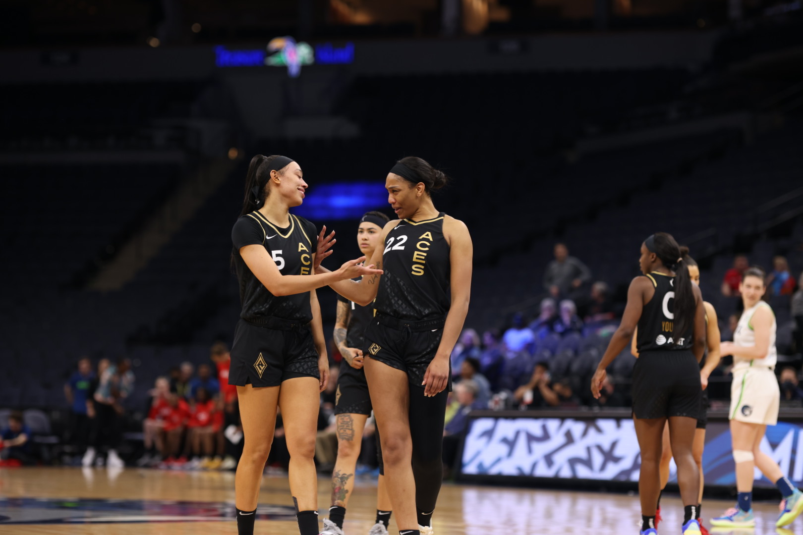 Las Vegas Aces forwards Dearica Hamby and A'ja Wilson talk on the court during a preseason game against the Minnesota Lynx at Target Center in Minneapolis, Minn., on May 1, 2022. (Photo credit: John McClellan | The Next)
