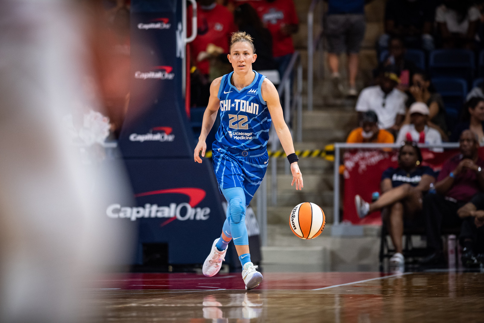 Chicago Sky point guard Courtney Vandersloot dribbles in the backcourt with her left hand while looking upcourt.