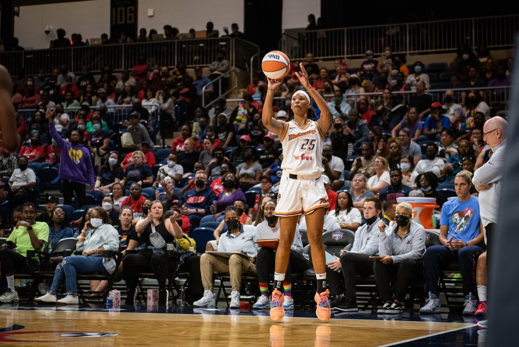 Jennie Simms of the Phoenix Mercury shoots a three.