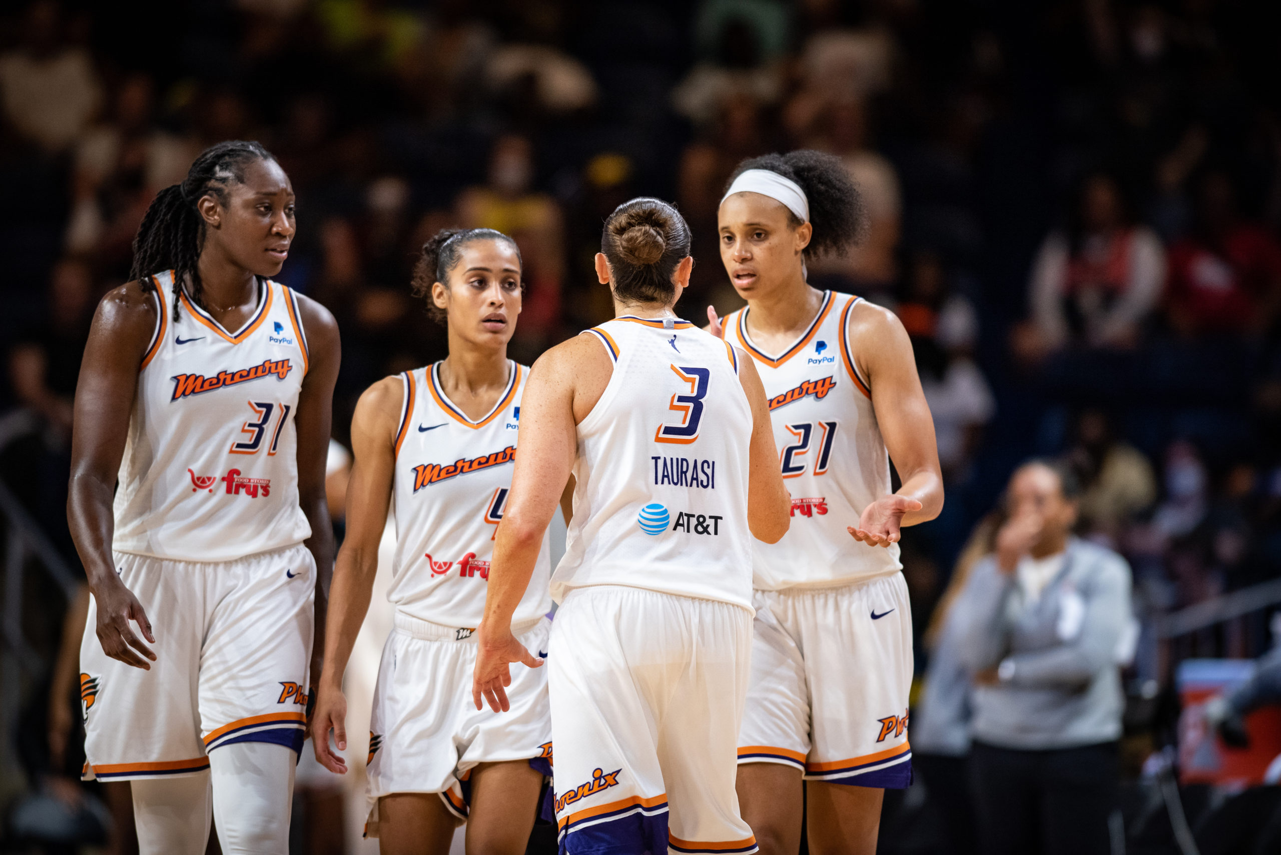 Diana Taurasi, Brianna Turner, Tina Charles and Skylar Diggins-Smith huddle during the team's June 12 99-90 overtime win over the Washington Mystics.