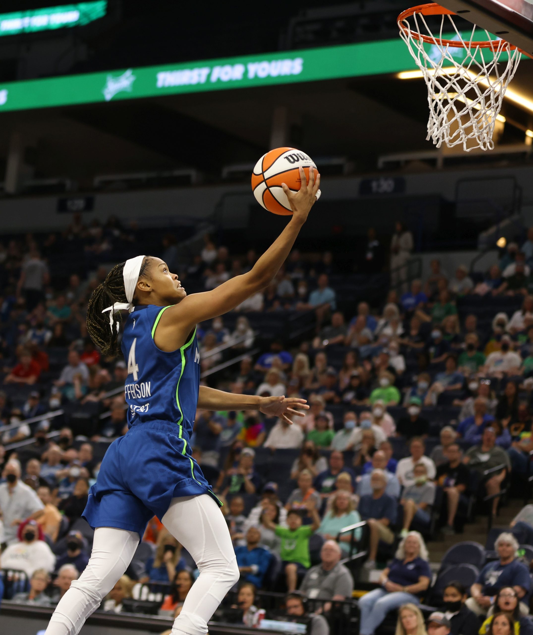 Minnesota Lynx point guard Moriah Jefferson goes up with the ball in one hand as she attempts a layup