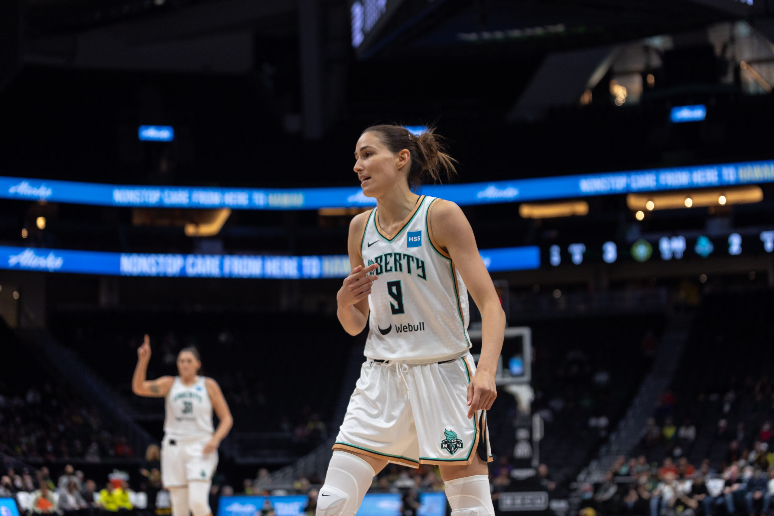 New York Liberty combo forward Rebecca Allen stands sideways