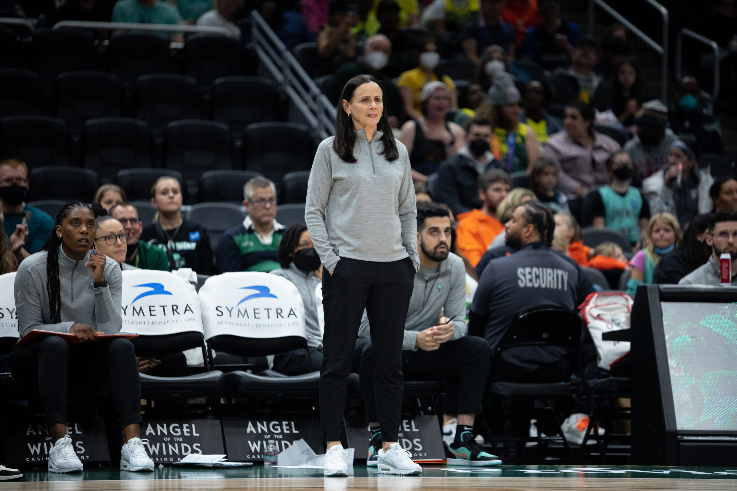New York head coach Sandy Brondello stands in front of the Liberty bench while looking out towards the court