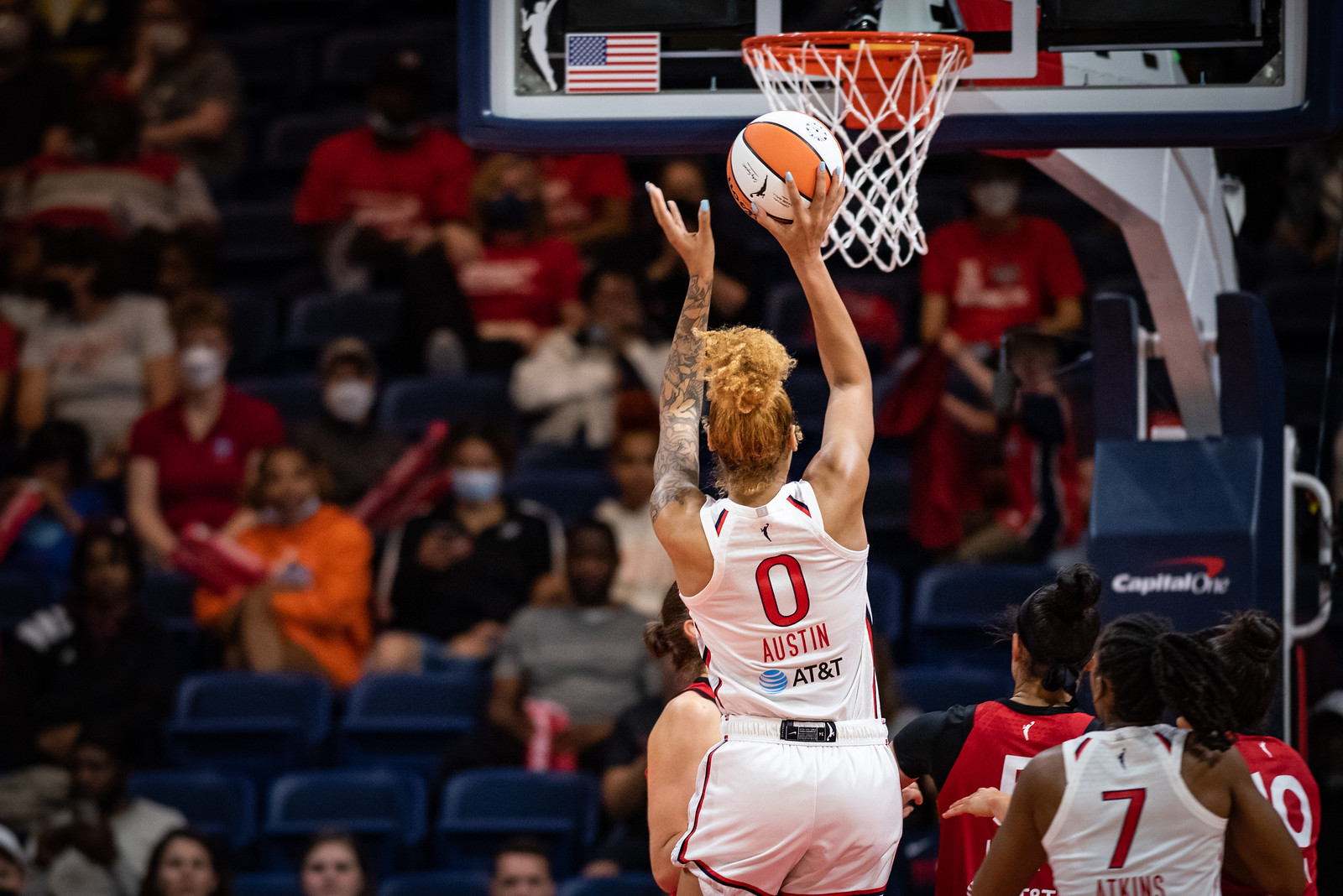 Washington Mystics center Shakira Austin goes up for a layup with one hand on the ball, right in front of the rim