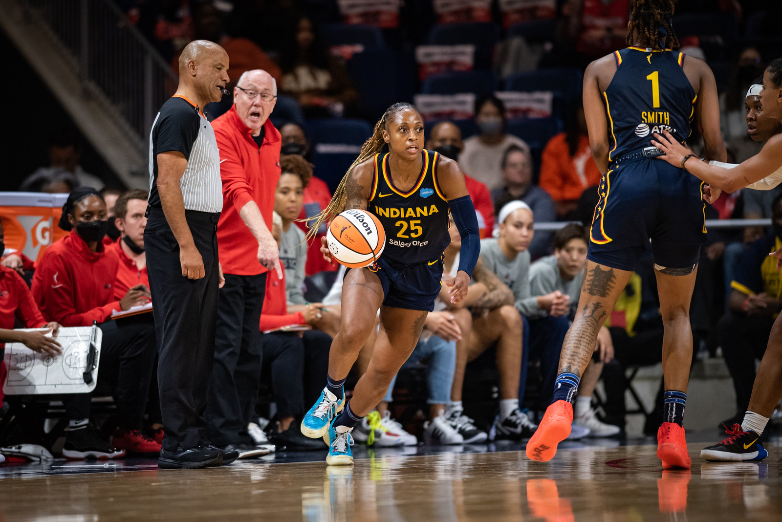 Indiana Fever off-ball guard Tiffany Mitchell dribbles upcourt from the corner