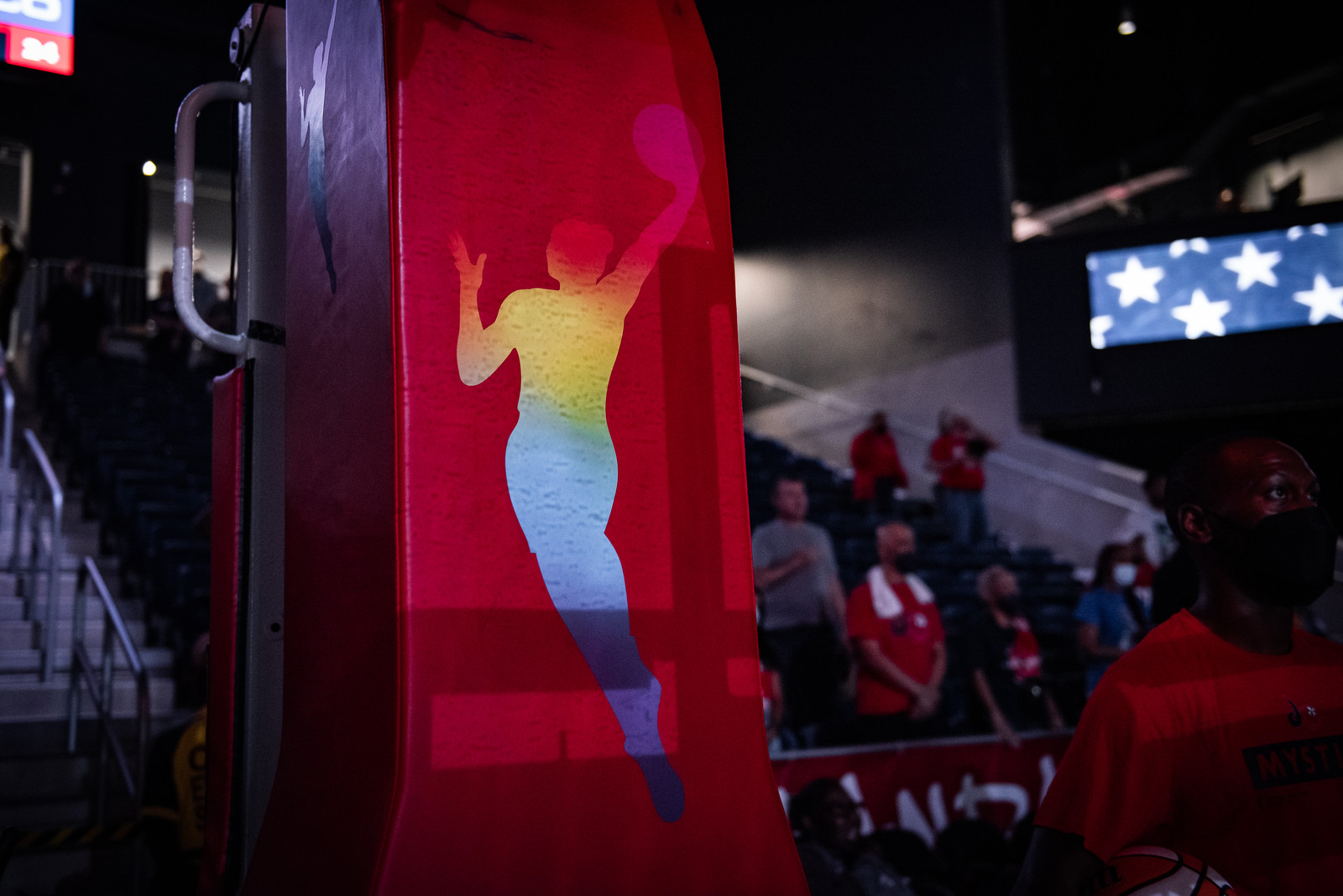 The WNBA logo on the front of a stanchion, in rainbow colors for Pride Month