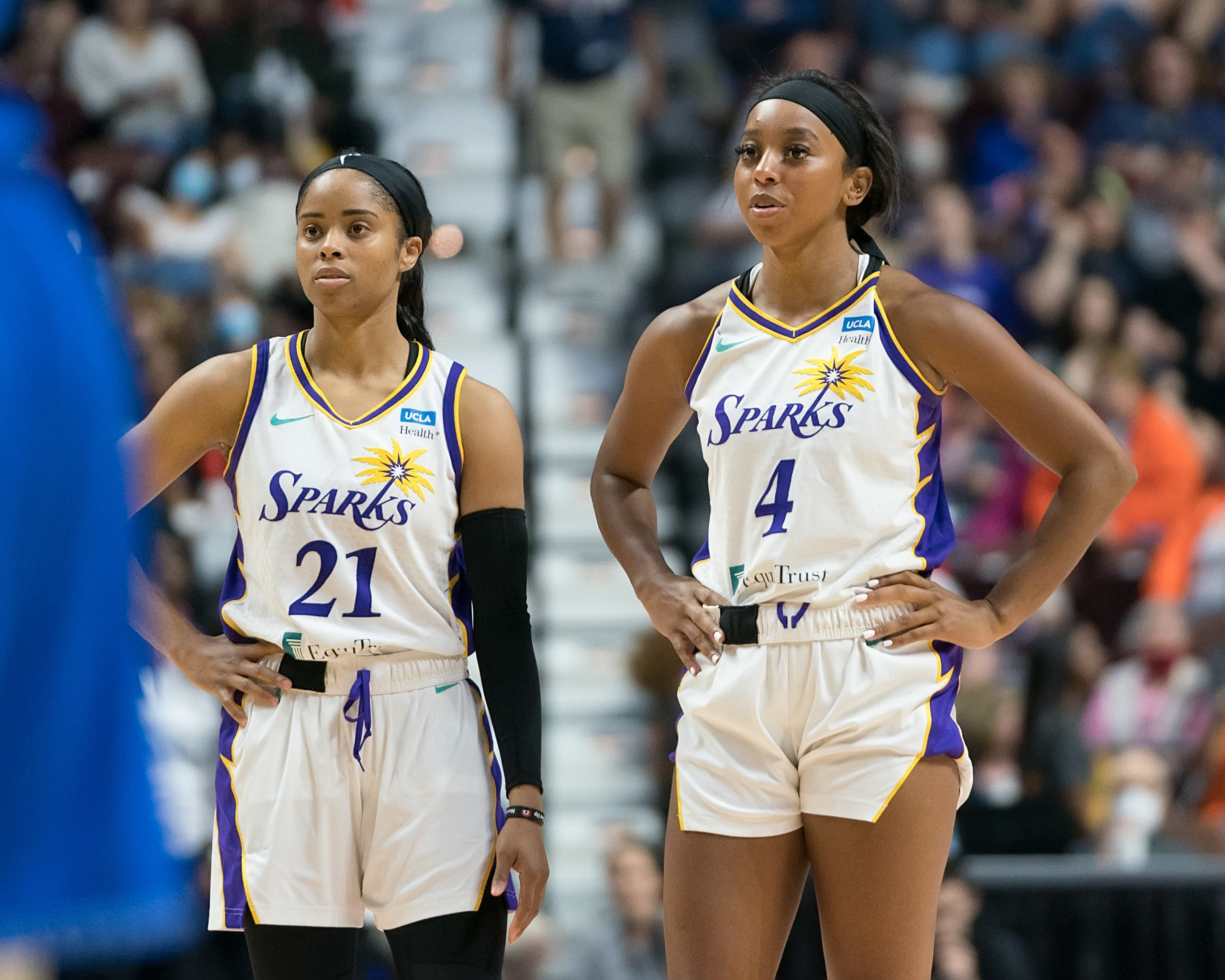 Los Angeles Sparks guards Jordin Canada (21) and Lexie Brown (4) stand next to each other during a game against the Connecticut Sun at Mohegan Sun Arena in Uncasville, Conn., on May 14, 2022. (Photo credit: Chris Poss)