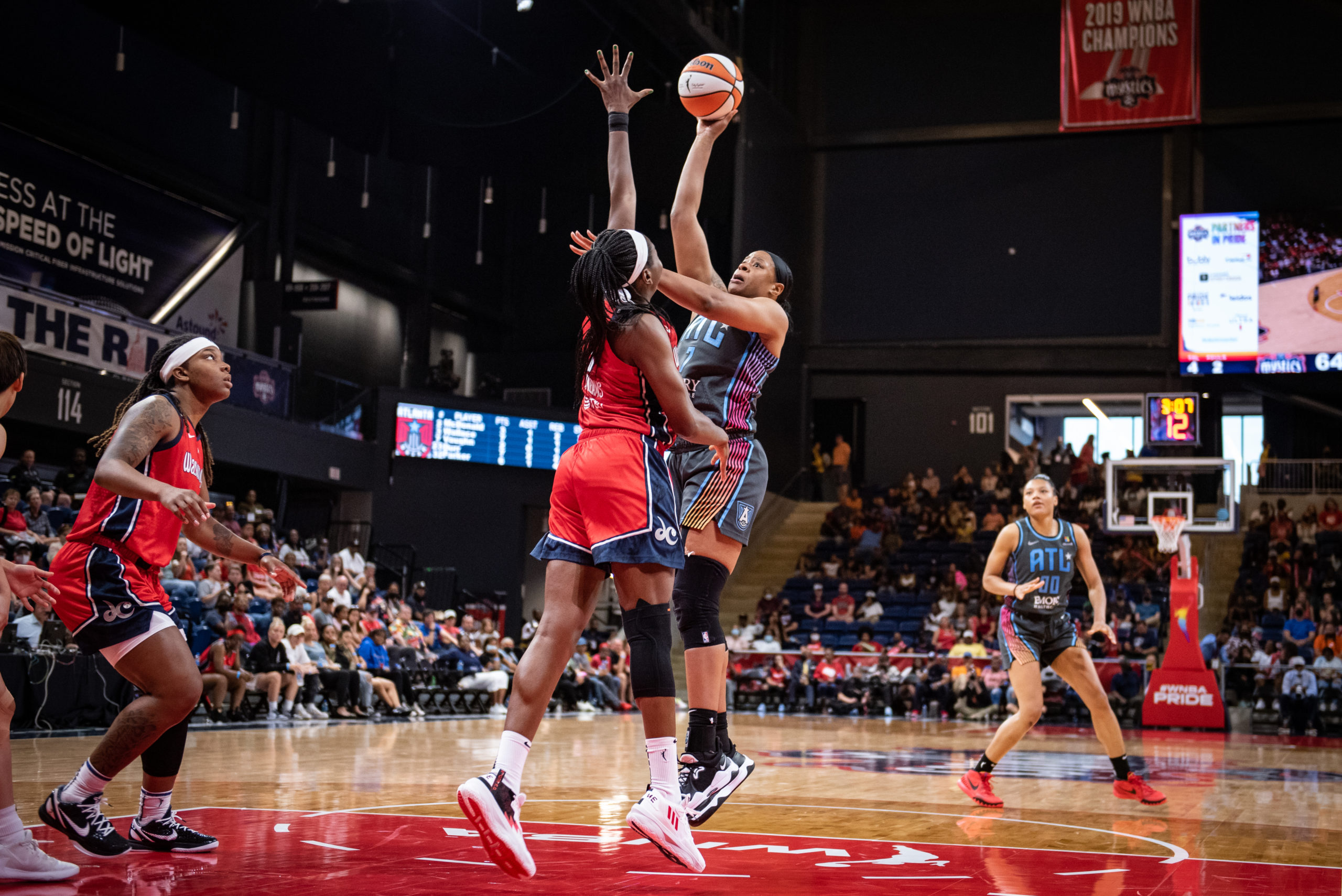 Atlanta Dream center Kia Vaughn (7) shoots against Washington Mystics forward Elizabeth Williams (1) during a game at the Entertainment and Sports Arena in Washington, D.C., on June 28, 2022. (Photo credit: Domenic Allegra)