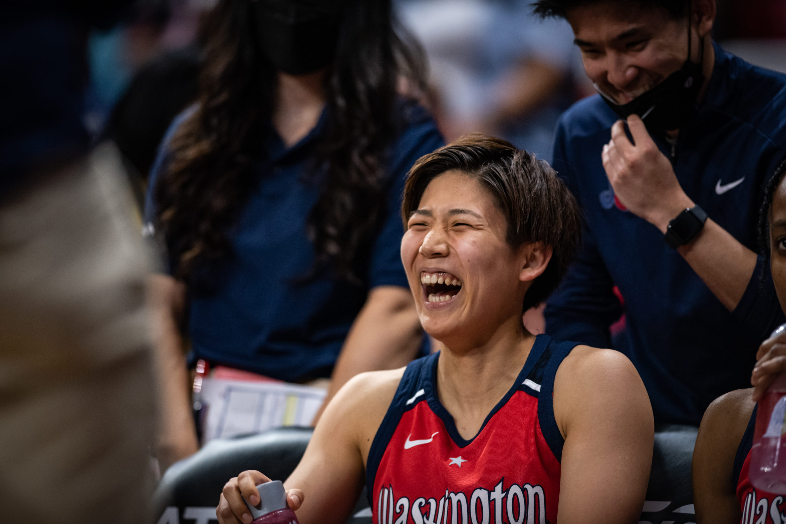 Washington Mystics point guard Rui Machida laughs on the bench during a game against the Atlanta Dream at the Entertainment and Sports Arena in Washington, D.C., on June 28, 2022. (Photo credit: Domenic Allegra)
