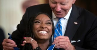 Simone Biles receives the Presidential Medal of Freedom from President Joe Biden Thursday. Credit: Tom Brenner for The Washington Post