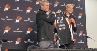 New Phoenix Mercury head coach Vanessa Nygaard holds up a Mercury jersey with general manager Jim Pitman at her introductory press conference on Monday. (Photo credit: Alex Simon)