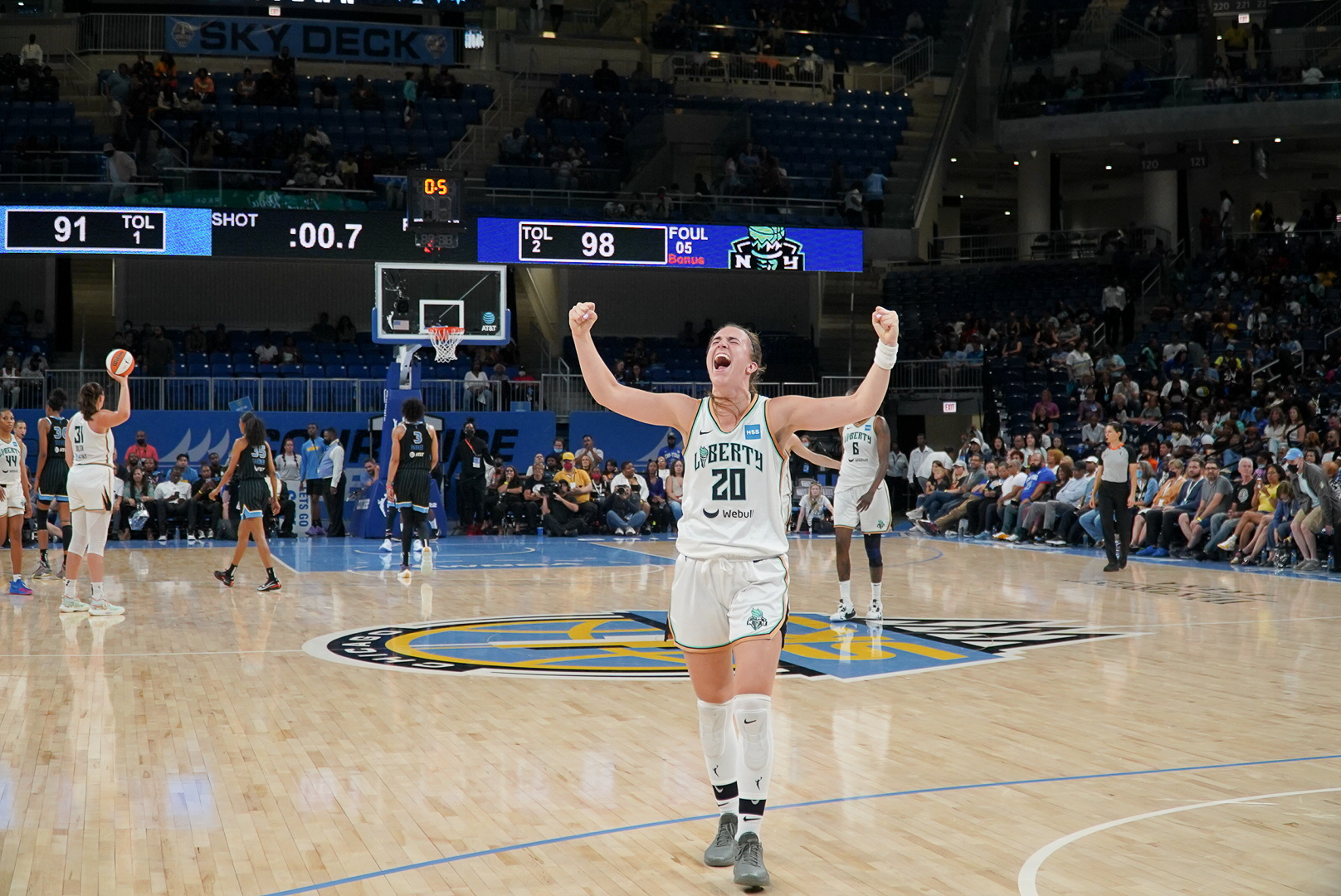 New York Liberty guard Sabrina Ionescu (20) raises her arms in celebration following a 98-91 playoff victory over the Chicago Sky at Wintrust Arena in Chicago, Ill., on Aug. 17, 2022. (Photo credit: Josh Sawyer)