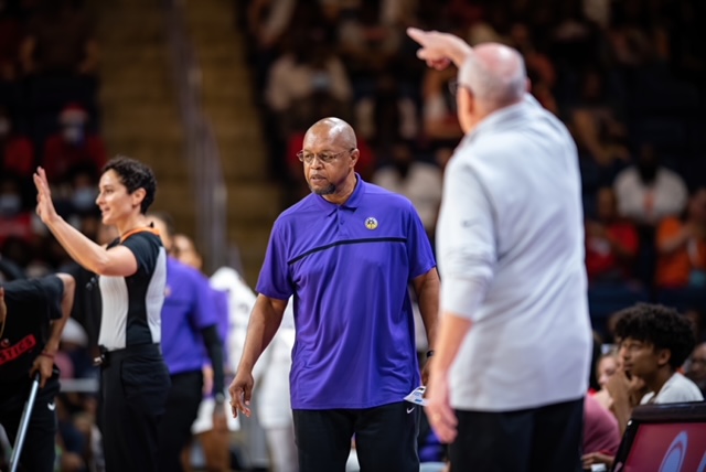 Los Angeles Sparks interim head coach Fred Williams (in purple) looks on during a game against Mike Thibault (in gray) and the Washington Mystics at the Entertainment and Sports Arena in Washington, D.C., on Aug. 7, 2022. (Photo credit: Domenic Allegra)