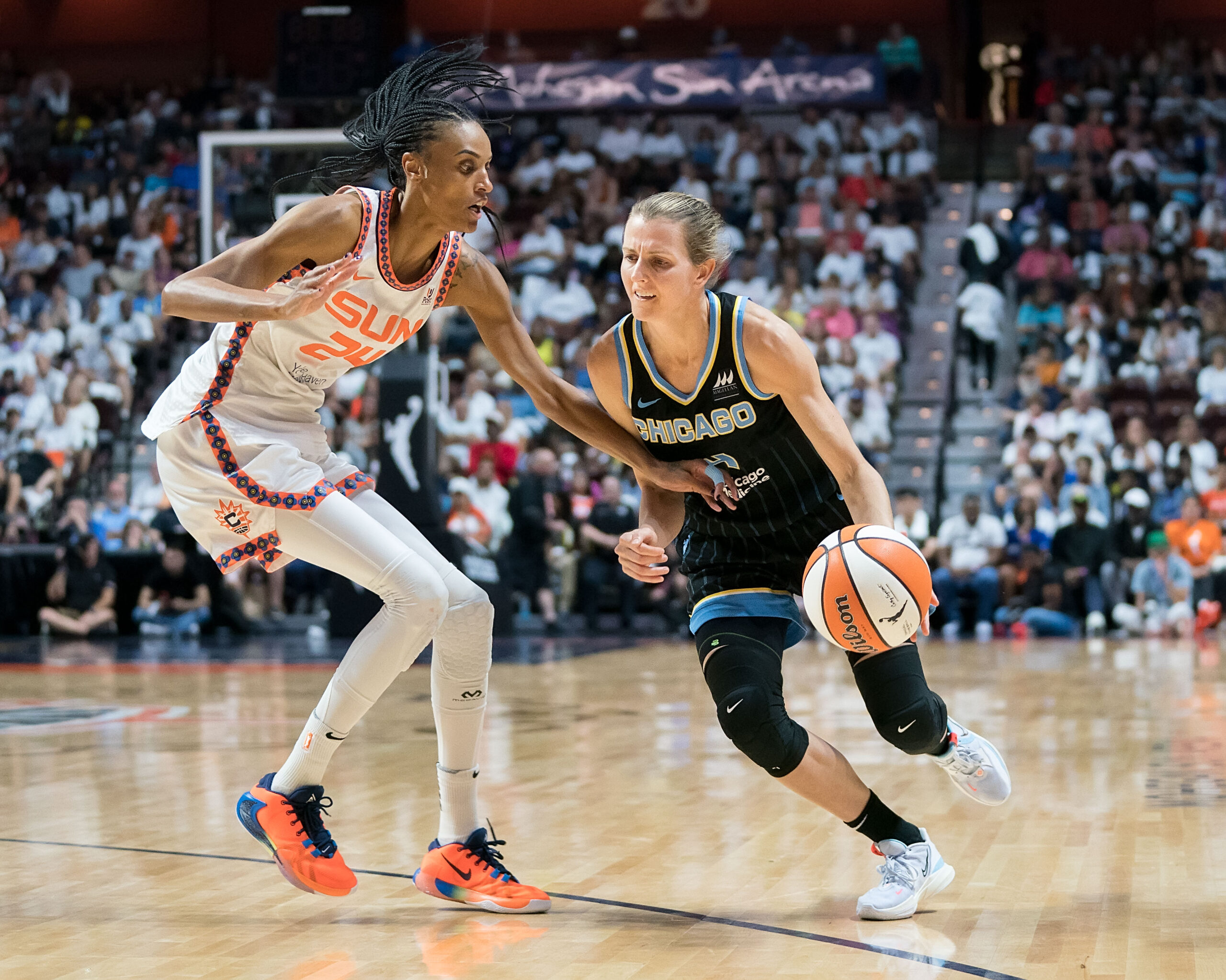 Chicago Sky guard Allie Quigley (14) drives to the basket as Connecticut Sun forward DeWanna Bonner (24) defends during Game 3 of the WNBA semifinals at Mohegan Sun Arena in Uncasville, Conn., on Sept. 4, 2022. (Photo credit: Chris Poss)