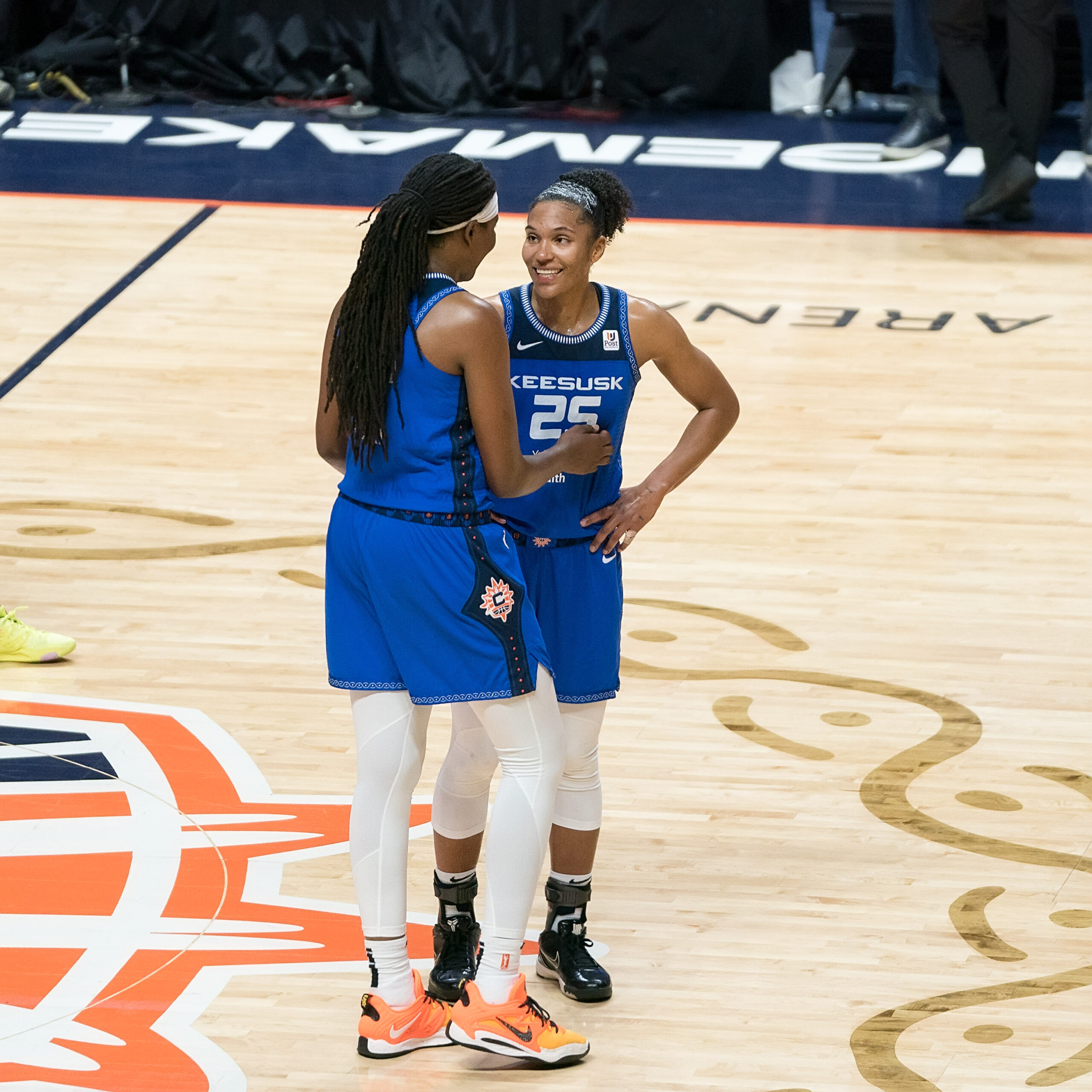 Connecticut Sun center Jonquel Jones congratulates teammate Alyssa Thomas after it was announced that Thomas recorded a triple-double.