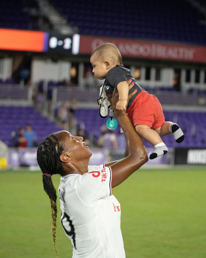New mom Crystal Dunn celebrates her first game back on the pitch. (Photo Credit: Portland Thorns on Twitter)