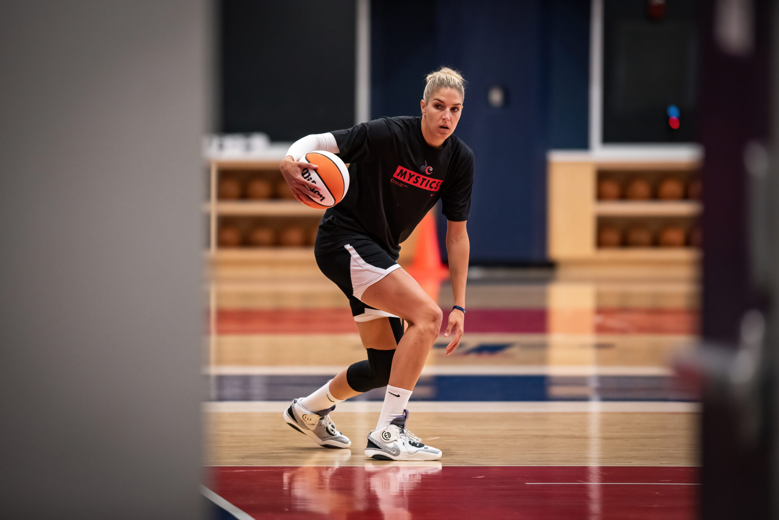 Elena Delle Donne warms up by dribbling a basketball on the Mystics' practice court.