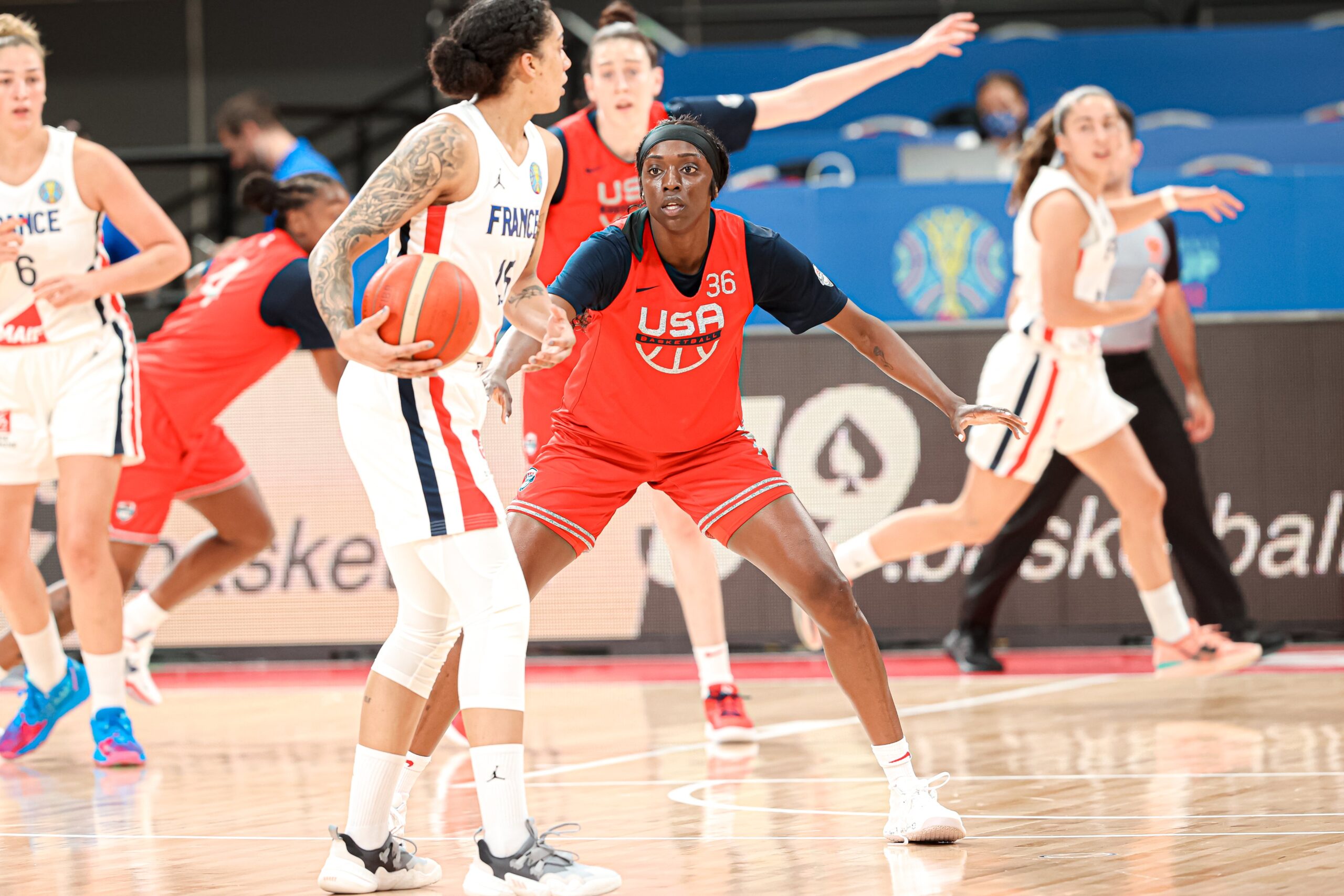 USA wing Kahleah Copper (36) defends France wing Gabby Williams (15), who looks for a teammate to pass to.