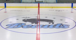 ACHA hockey photo featuring the ice of the Buffalo Beauts logo.
