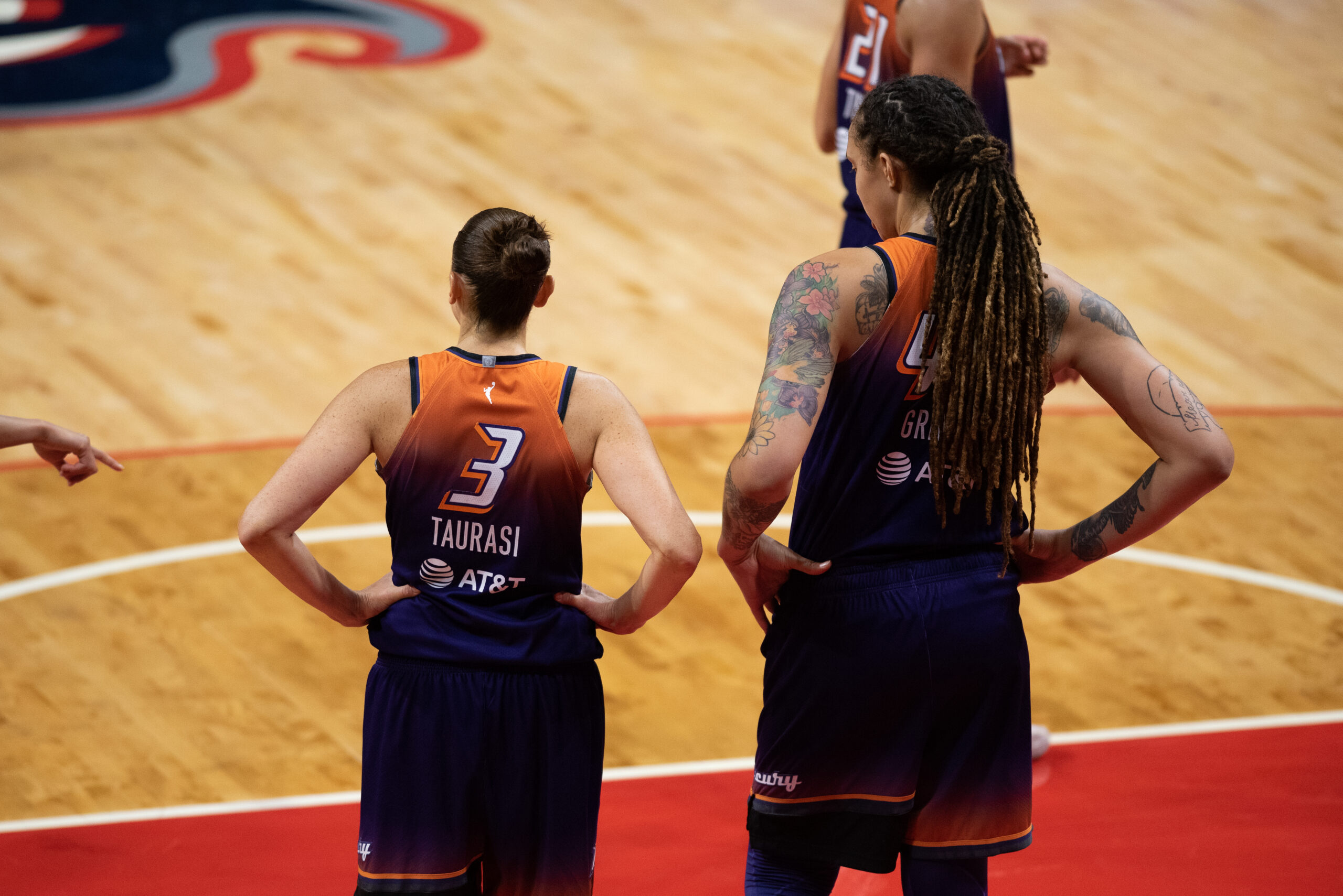 Brittney Griner (42) stands next to Phoenix Mercury teammate Diana Taurasi (3).