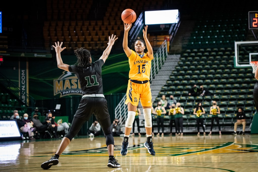 Kayla Spruill (yellow jersey) goes up for a shot over Amaya Scott of George Mason (black jersey) on January 21, 2022.