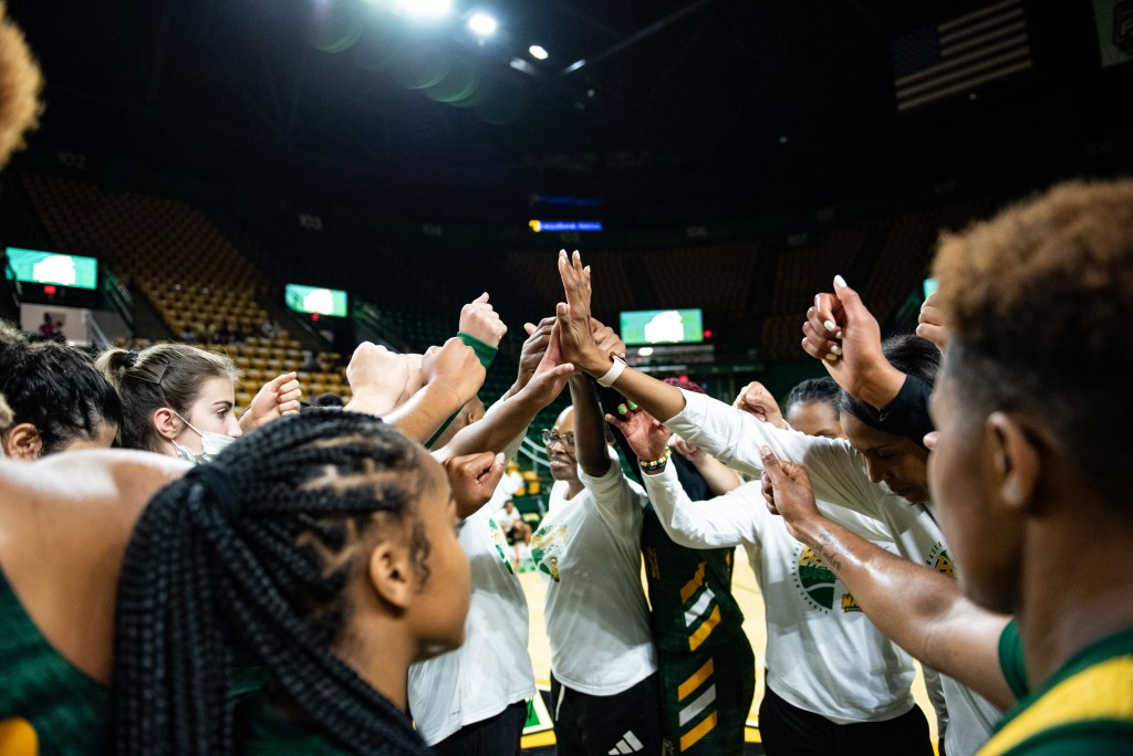 George Mason huddles at its open practice on September 17, 2022